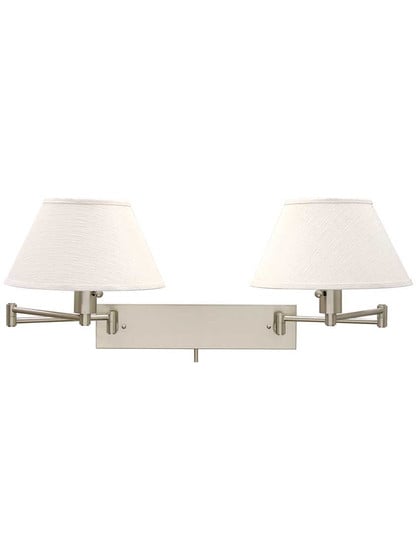 Finley Double Swing-Arm Wall Lamp in Satin Nickel.